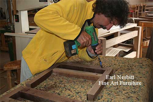Earl drilling mortises into frames for custom made live edge chairs